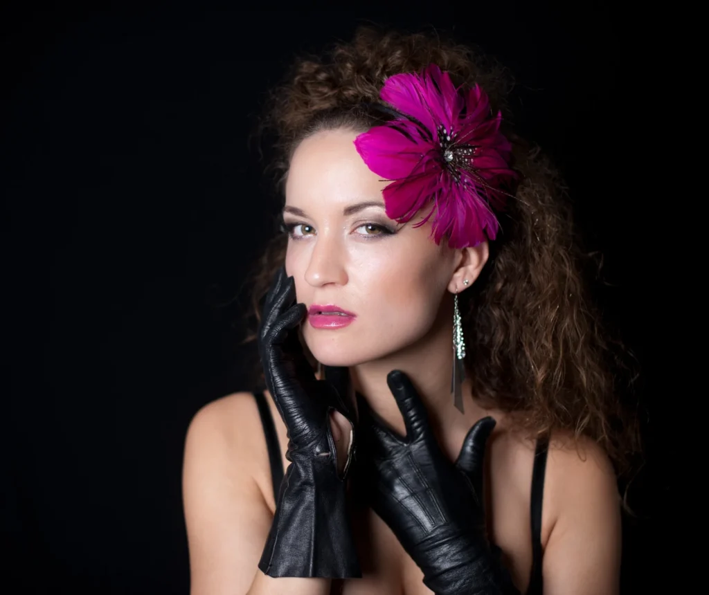 Portrait with a pink flower in dark hair