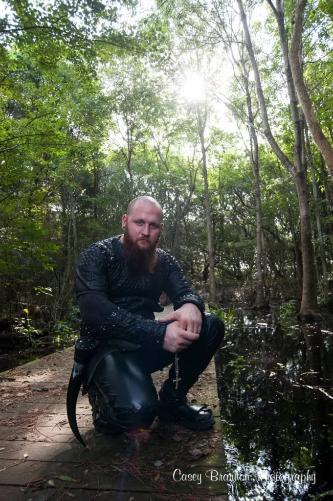Outdoor portrait seated in a wooded setting
