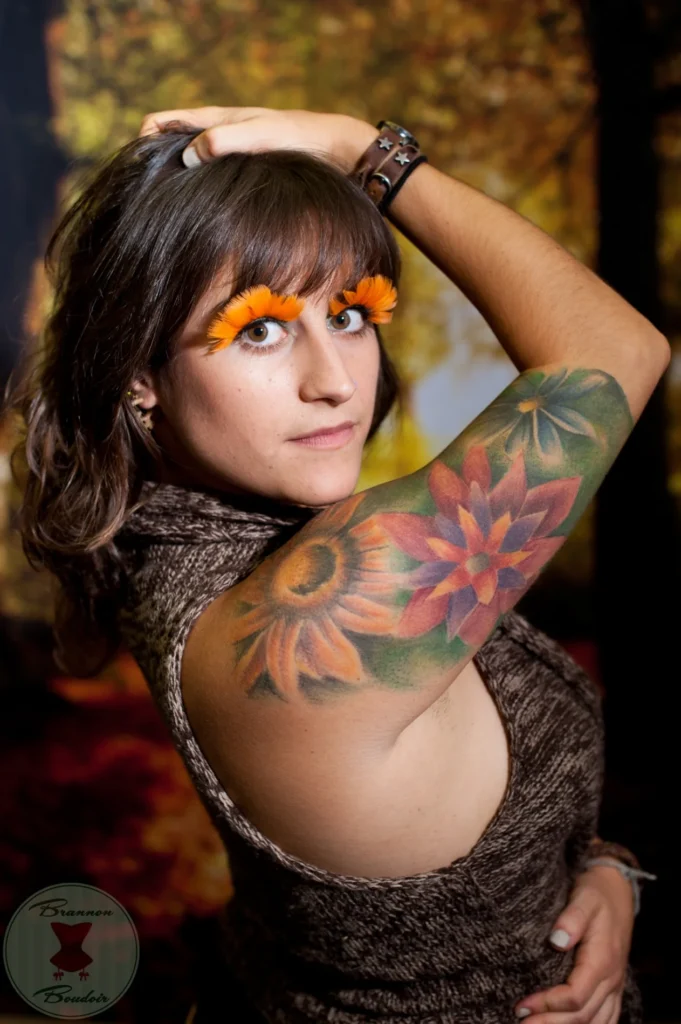 Portrait with colorful tattoos and sunglasses