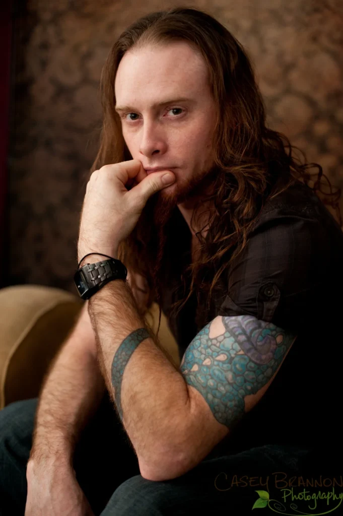 Thoughtful portrait of a man with long hair