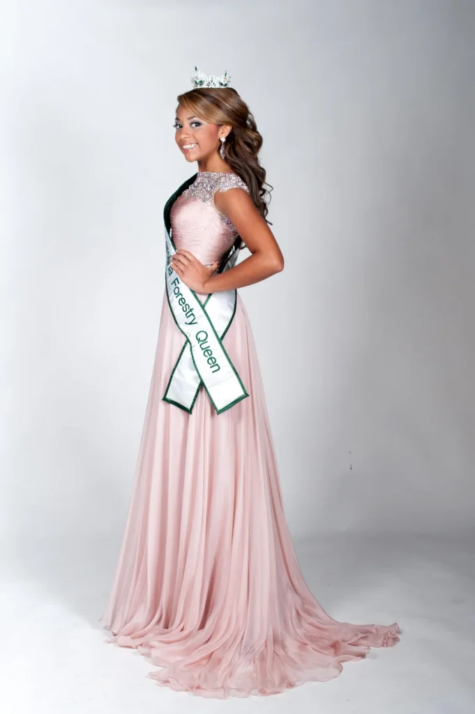 Full length studio portrait in a pink gown