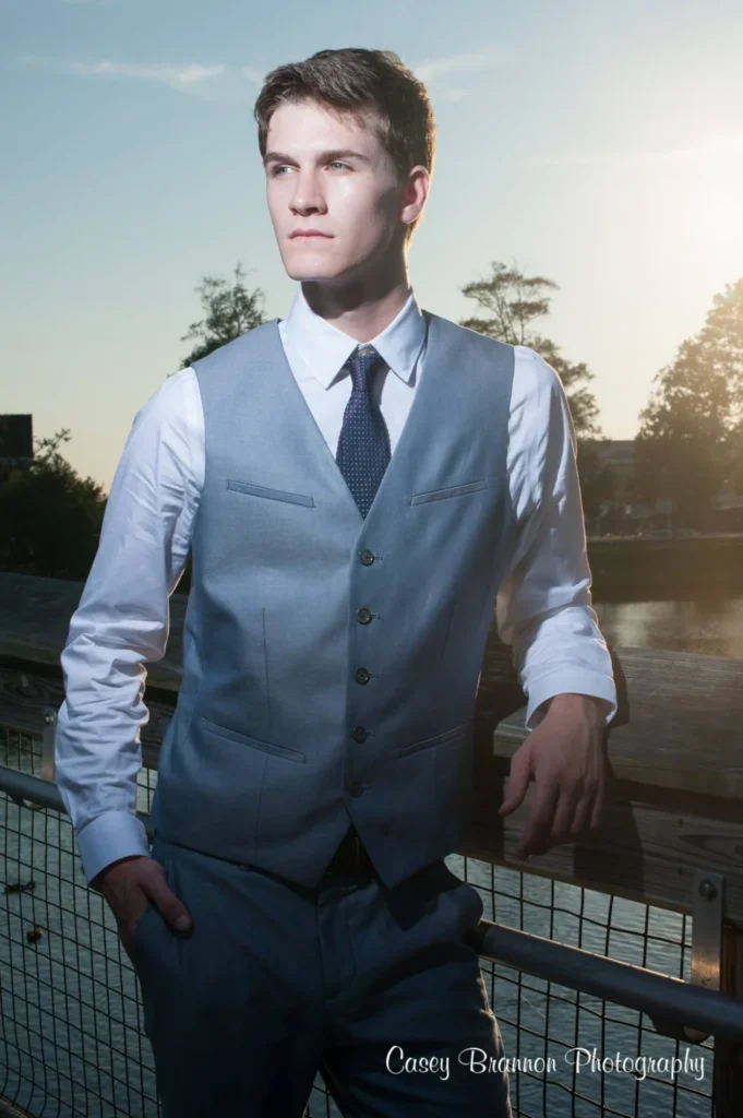 Senior portrait wearing a vest and tie outdoors