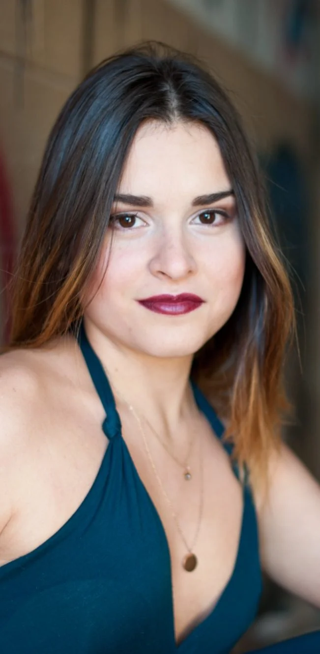 Senior portrait in a teal top with soft natural light