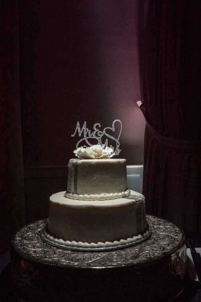 Three tier wedding cake with a newlywed topper