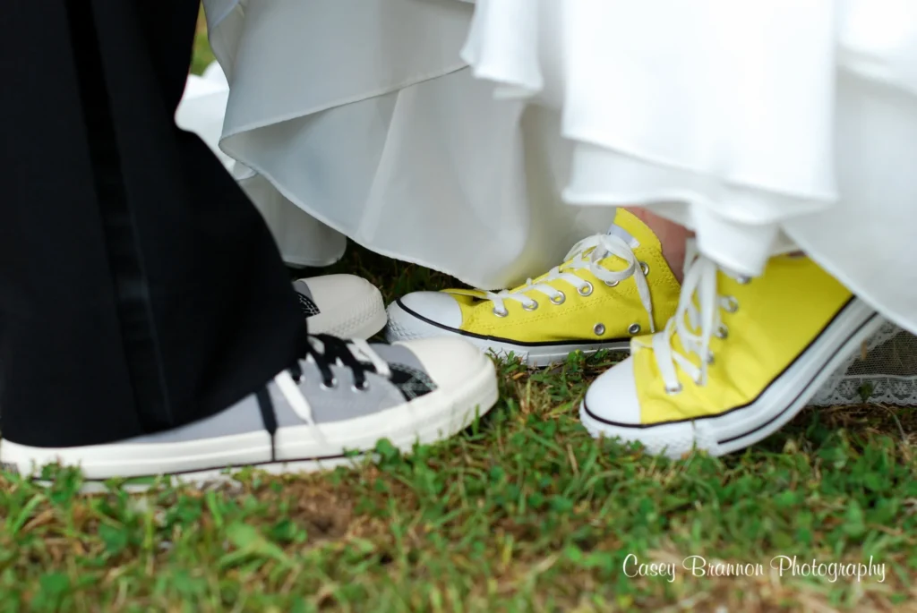 Newlyweds wearing matching bright yellow shoes