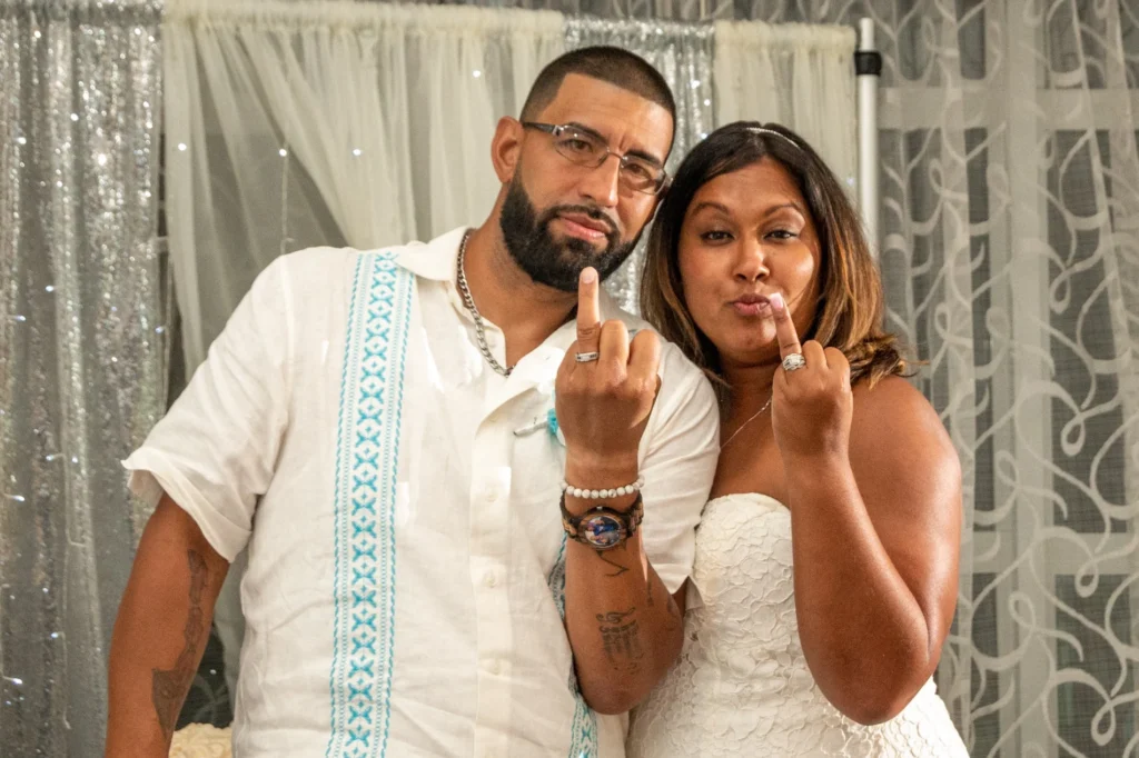 Newlyweds showing their wedding rings together