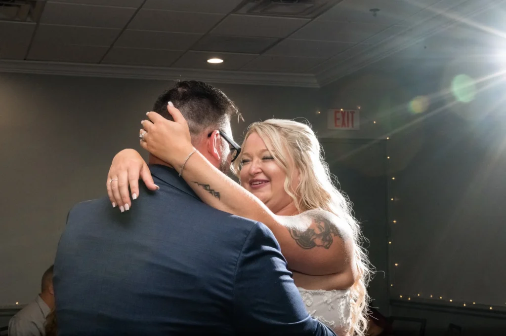 Bride and groom embracing during their celebration